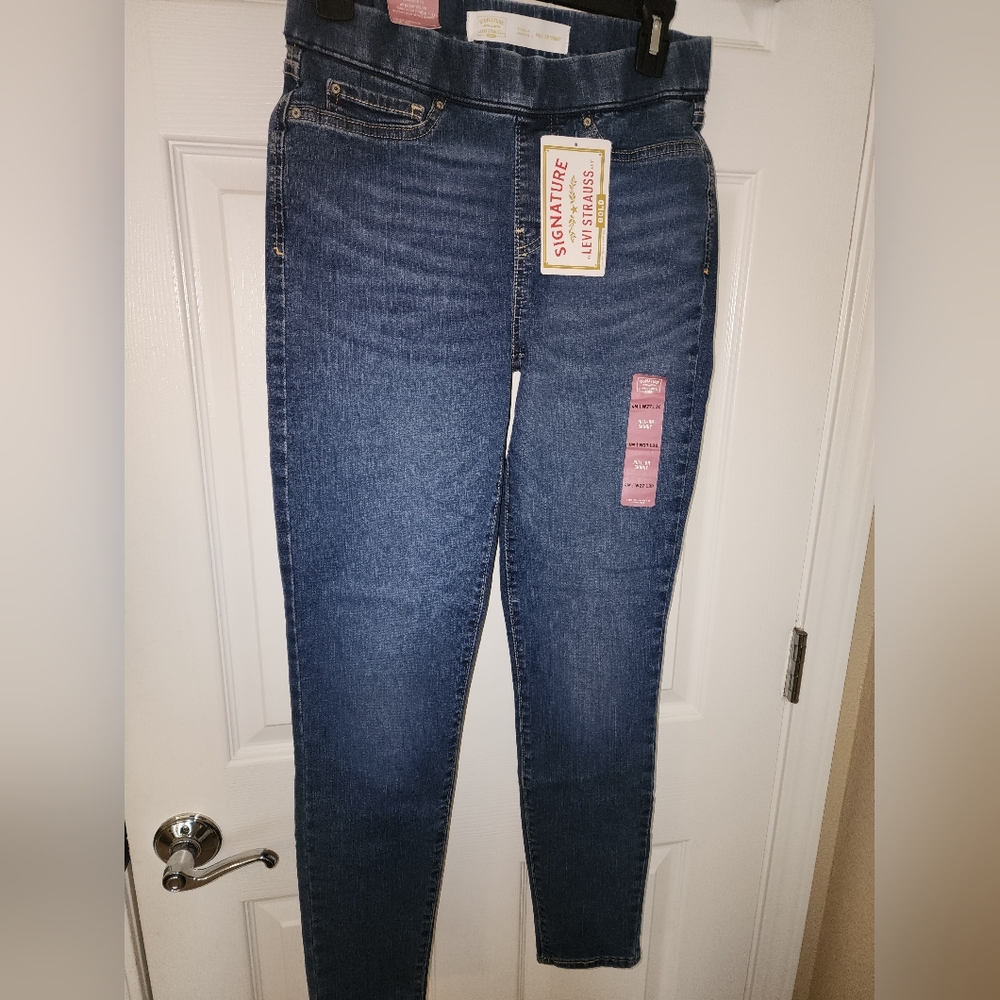 Signature by Levi Strauss.  Pull on skinny distressed dark denim.